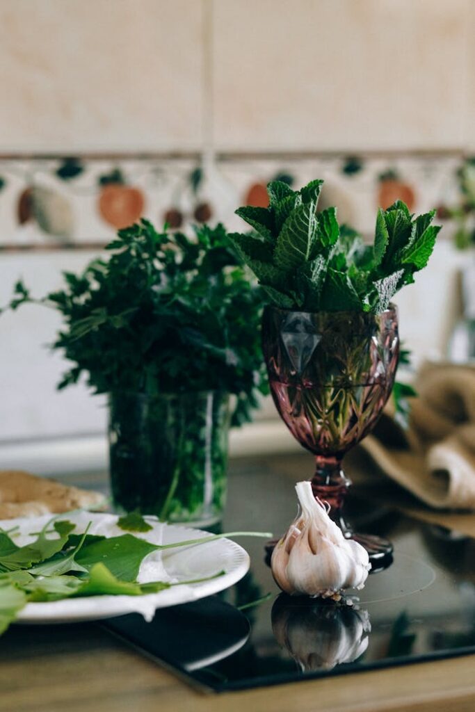 pexels photo 7615351 Aesthetic herbal arrangement with garlic, fresh mint, and parsley in a kitchen.